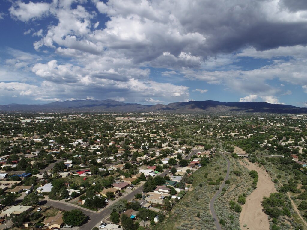 aerial photo of Santa Fe, NM with mountains in the background