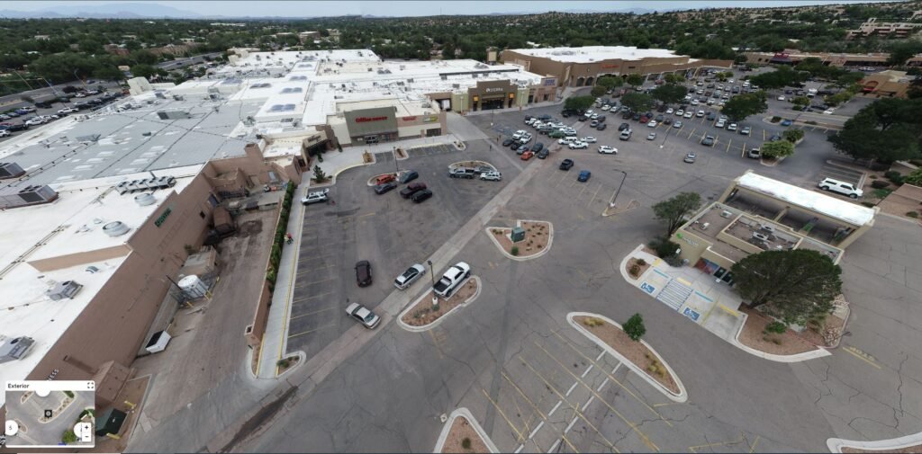 aerial panorama of a shopping center parking lot