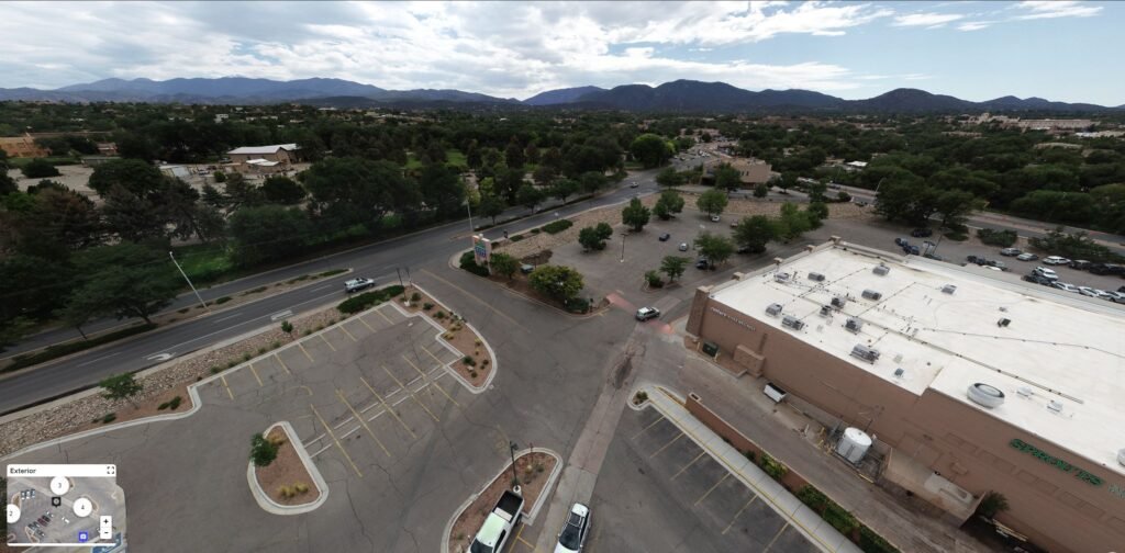 aerial panorama of a shopping center parking lot